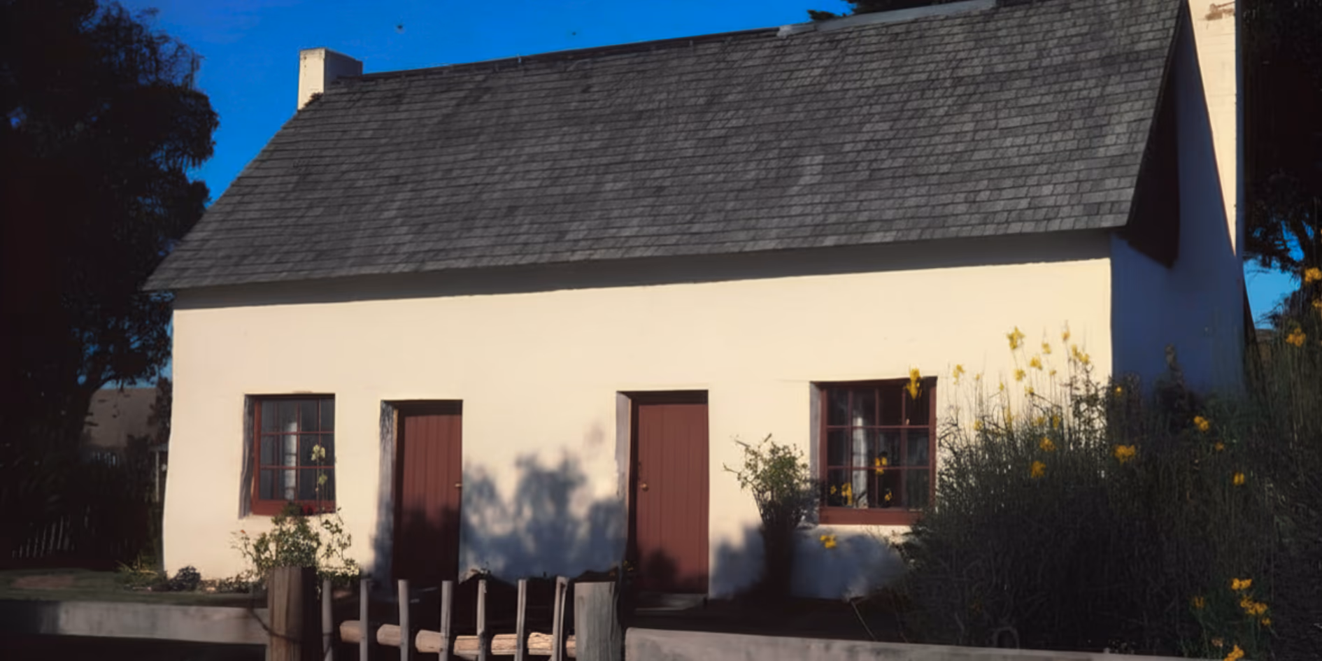 Riverlands Cob Cottage showing restored clay earth walls and thatched roof construction in Marlborough